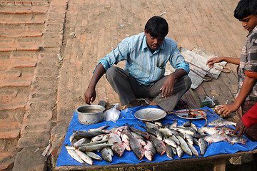 Image showing Selling a fish on fish market in Canning, West Bengal, India