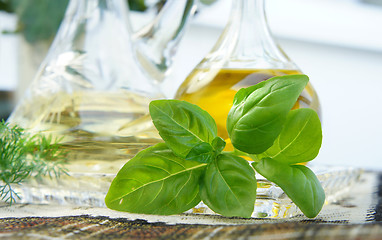 Image showing Olive oil, vinegar and basil 