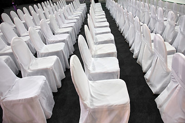 Image showing Rows of white chairs