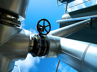 Image showing Industrial zone, Steel pipelines and valves against blue sky