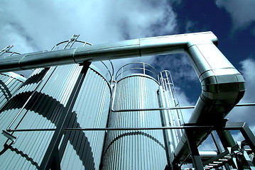 Image showing Industrial zone, Steel pipelines and valves against blue sky