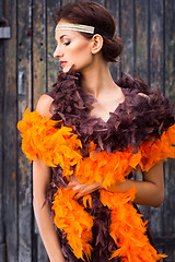 Image showing girl in brown and orange boa