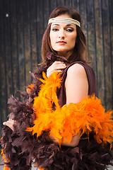 Image showing girl in brown and orange boa