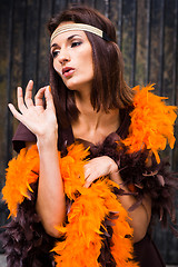 Image showing  actress in brown and orange boa