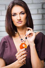 Image showing beautiful girl posing against brick wall