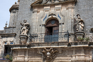 Image showing Part of facade with two statues.