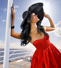 Image showing beautiful woman in red dress on the yacht