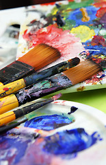 Image showing Art palette and paintbrushes 