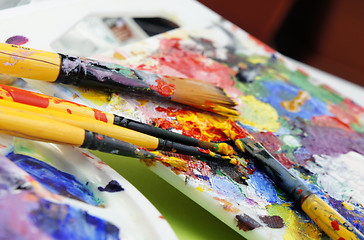 Image showing Art palette and paintbrushes 