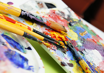 Image showing Art palette and paintbrushes 