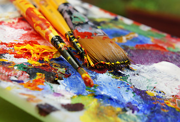 Image showing Art palette and paintbrushes 