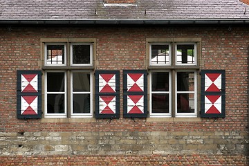 Image showing Red brick wall with two windows