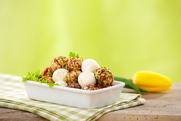 Image showing fresh cheese balls with oil and spices