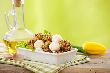 Image showing fresh cheese balls with oil and spices