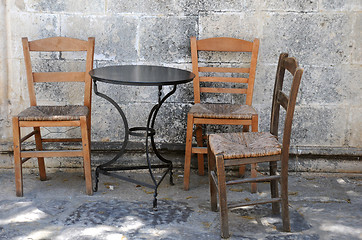 Image showing Three Old Chairs and One Table