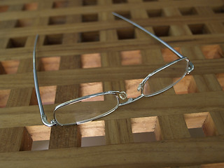 Image showing Glasses on a teak table