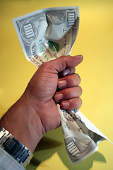 Image showing Holding 100 dollars