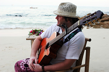 Image showing Musician on the beach