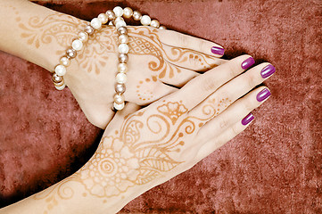 Image showing Henna art on woman's hand