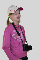 Image showing Smiling girl with a camera