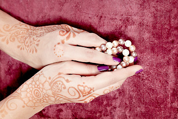 Image showing Henna art on woman's hand