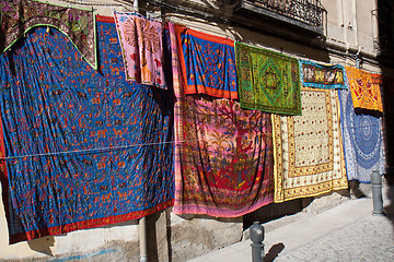 Image showing Colorful fabrics in the street 