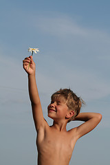 Image showing Child with flower