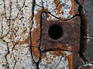 Image showing Rusty metal element in concrete wall