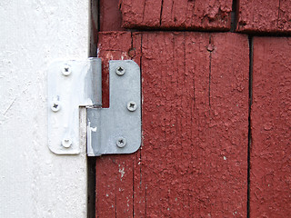 Image showing Old hinge on a wooden door