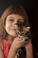 Image showing child with a kitten