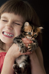 Image showing child with a kitten