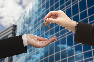 Image showing Female Handing Over the Keys in Front of Corporate Building