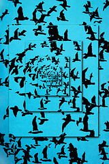 Image showing Set of silhouettes of birds on a blue background