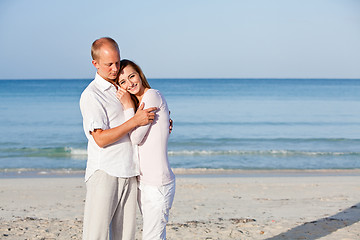 Image showing happy couple in love having fun on the beach