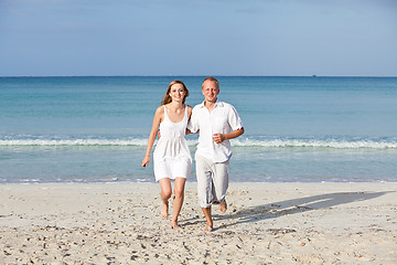 Image showing happy couple in love having fun on the beach