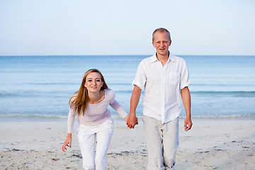 Image showing happy couple in love having fun on the beach