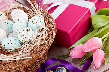 Image showing pink present and colorful tulips festive easter decoration