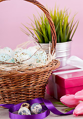 Image showing pink present and colorful tulips festive easter decoration