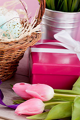 Image showing pink present and colorful tulips festive easter decoration