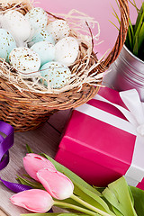 Image showing pink present and colorful tulips festive easter decoration