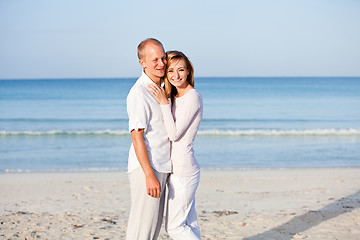 Image showing happy couple in love having fun on the beach
