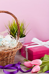 Image showing pink present and colorful tulips festive easter decoration