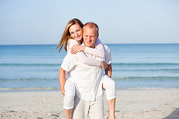 Image showing happy couple in love having fun on the beach