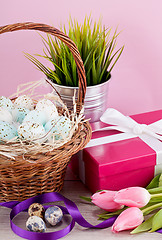 Image showing pink present and colorful tulips festive easter decoration