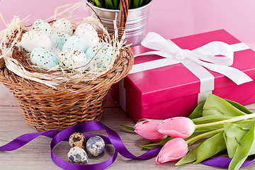 Image showing pink present and colorful tulips festive easter decoration