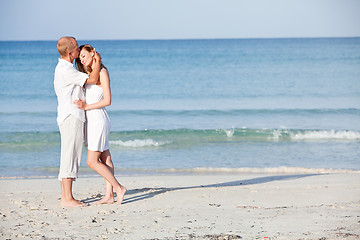 Image showing happy couple in love having fun on the beach