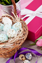 Image showing pink present and colorful tulips festive easter decoration