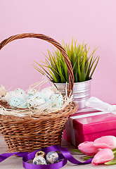 Image showing pink present and colorful tulips festive easter decoration