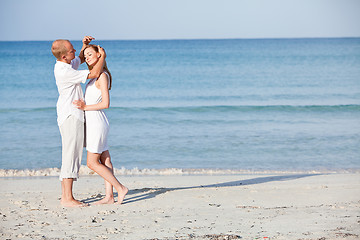 Image showing happy couple in love having fun on the beach