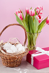 Image showing pink present and colorful tulips festive easter decoration